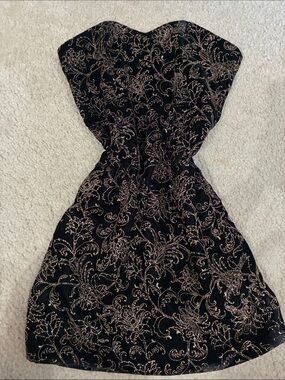 Hand-sawn Vintage off the runway Cache Elegant Black and Gold mini Dress